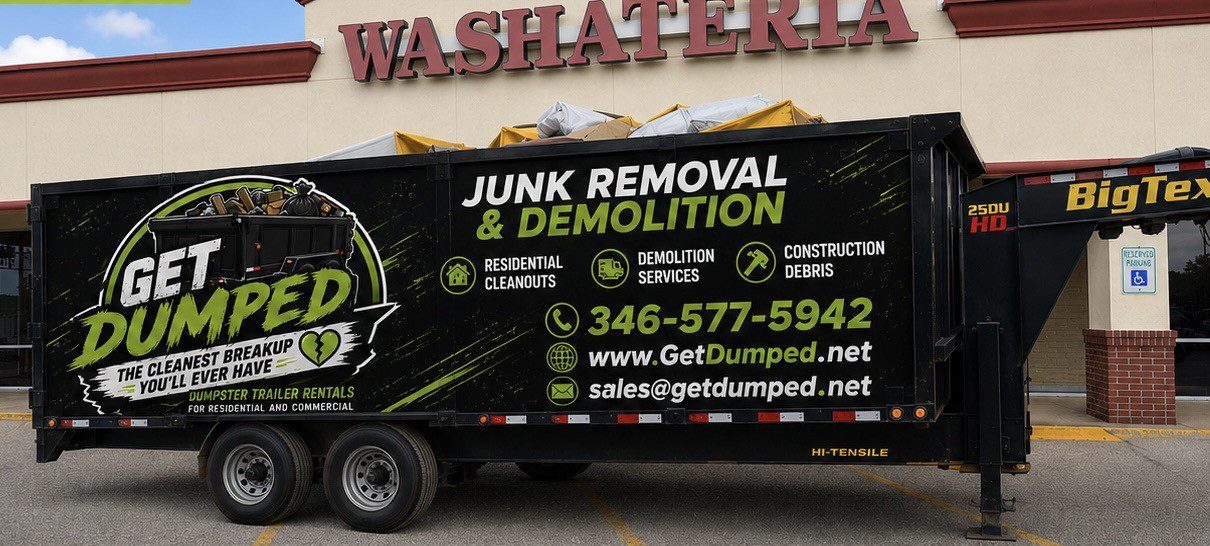 Black junk removal trailer outside laundromat