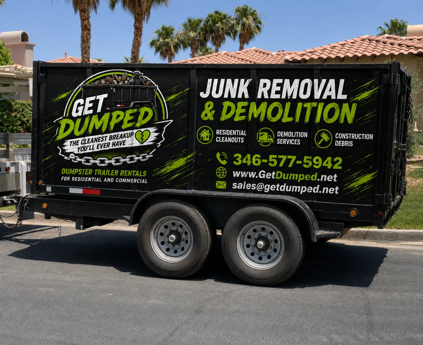 Black dumpster trailer advertising junk removal services